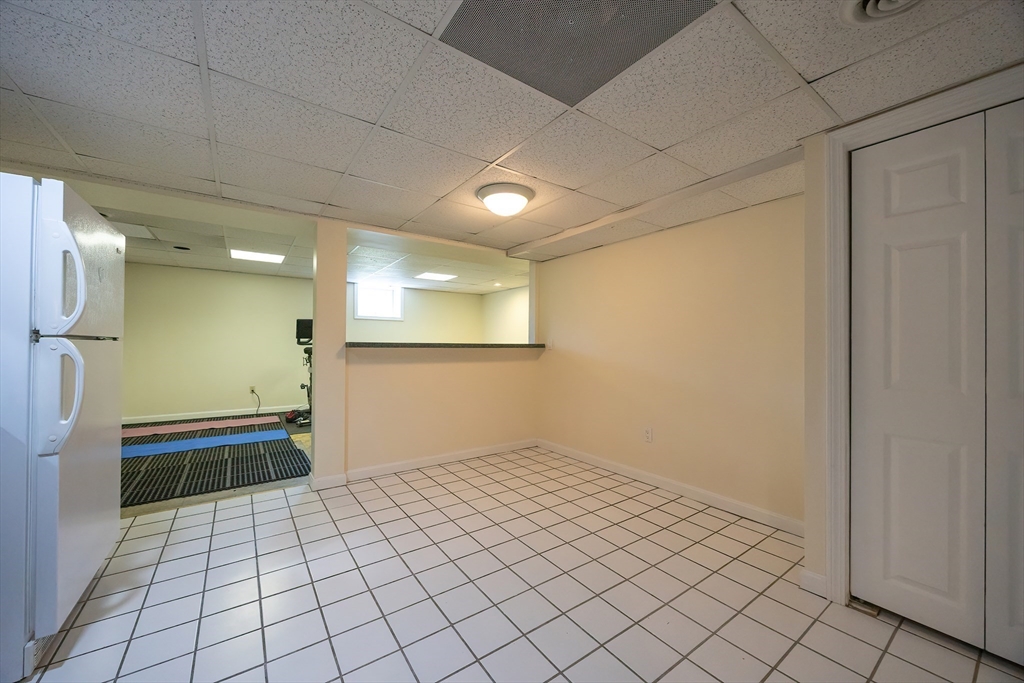 5 Windsor Road Lynnfield, MA 01940 - Photo 31 of 40 a bathroom with a sink a toilet and a shower