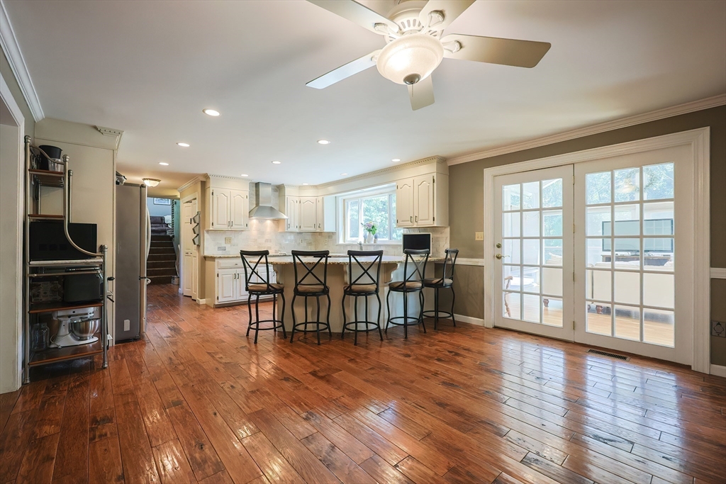 5 Windsor Road Lynnfield, MA 01940 - Photo 4 of 40 a view of a dining room with furniture window and wooden floor