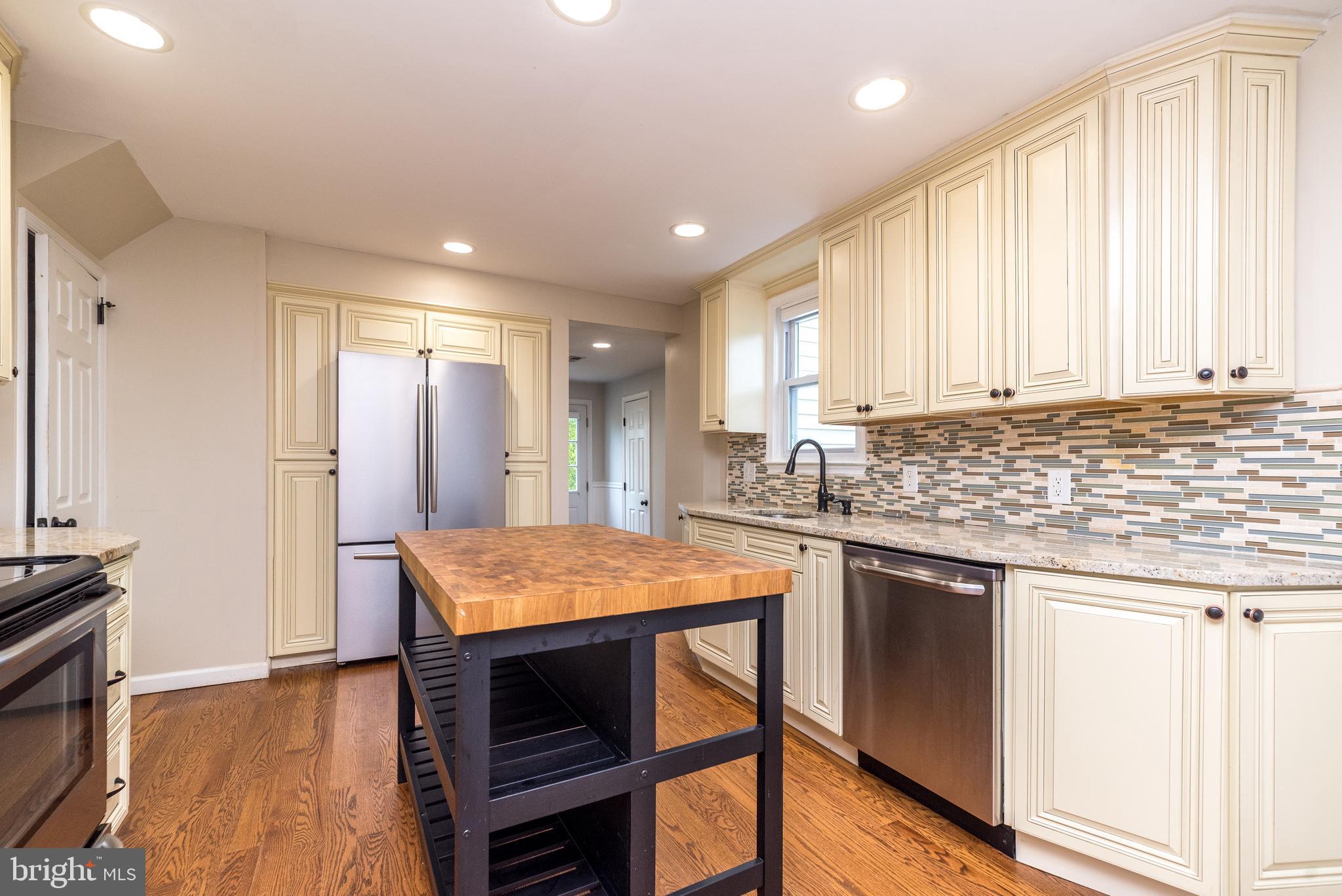 1425 Leedom Road Havertown, PA 19083 - Photo 11 of 46 a kitchen with stainless steel appliances granite countertop refrigerator sink and cabinets
