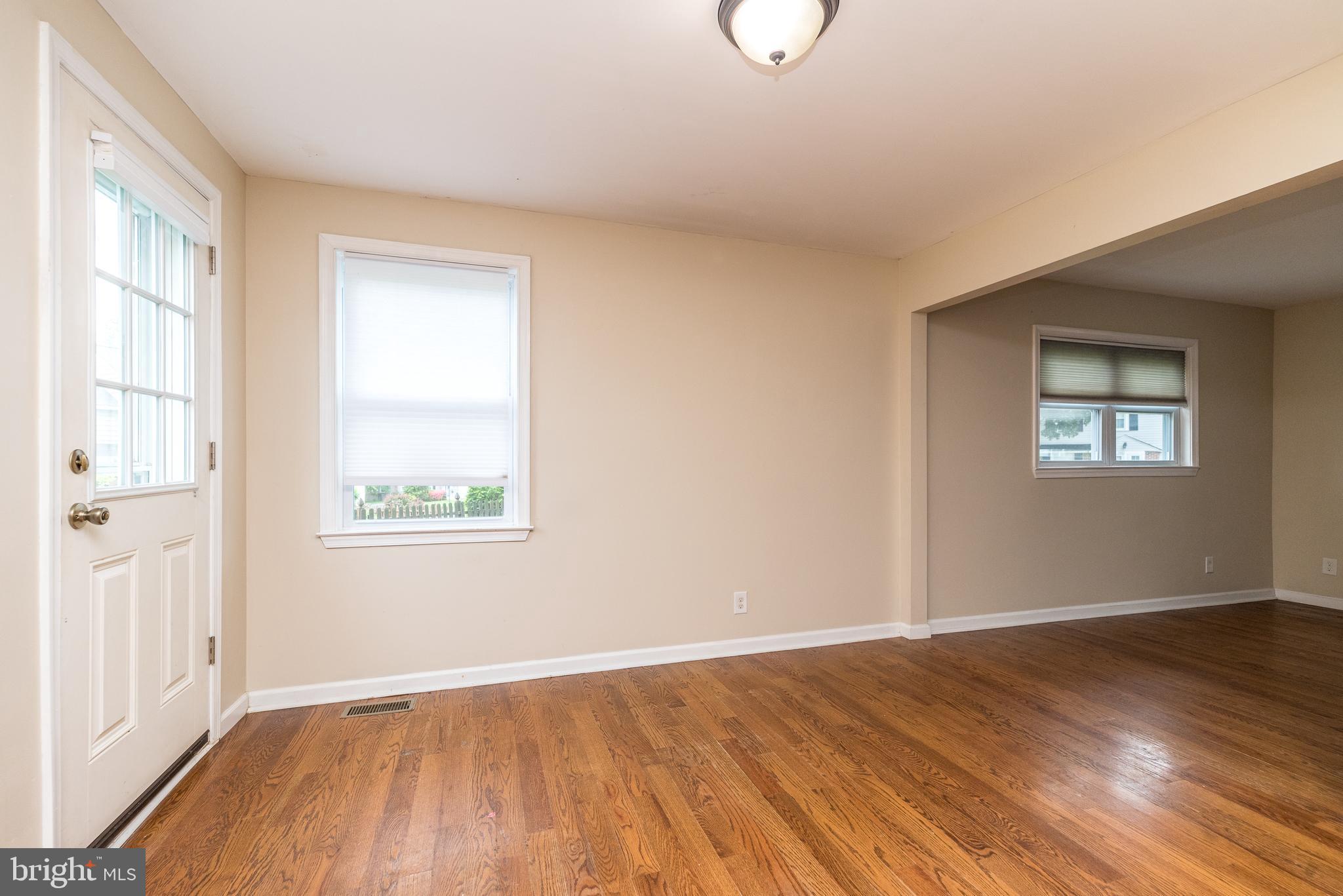 1425 Leedom Road Havertown, PA 19083 - Photo 15 of 46 an empty room with wooden floor and windows