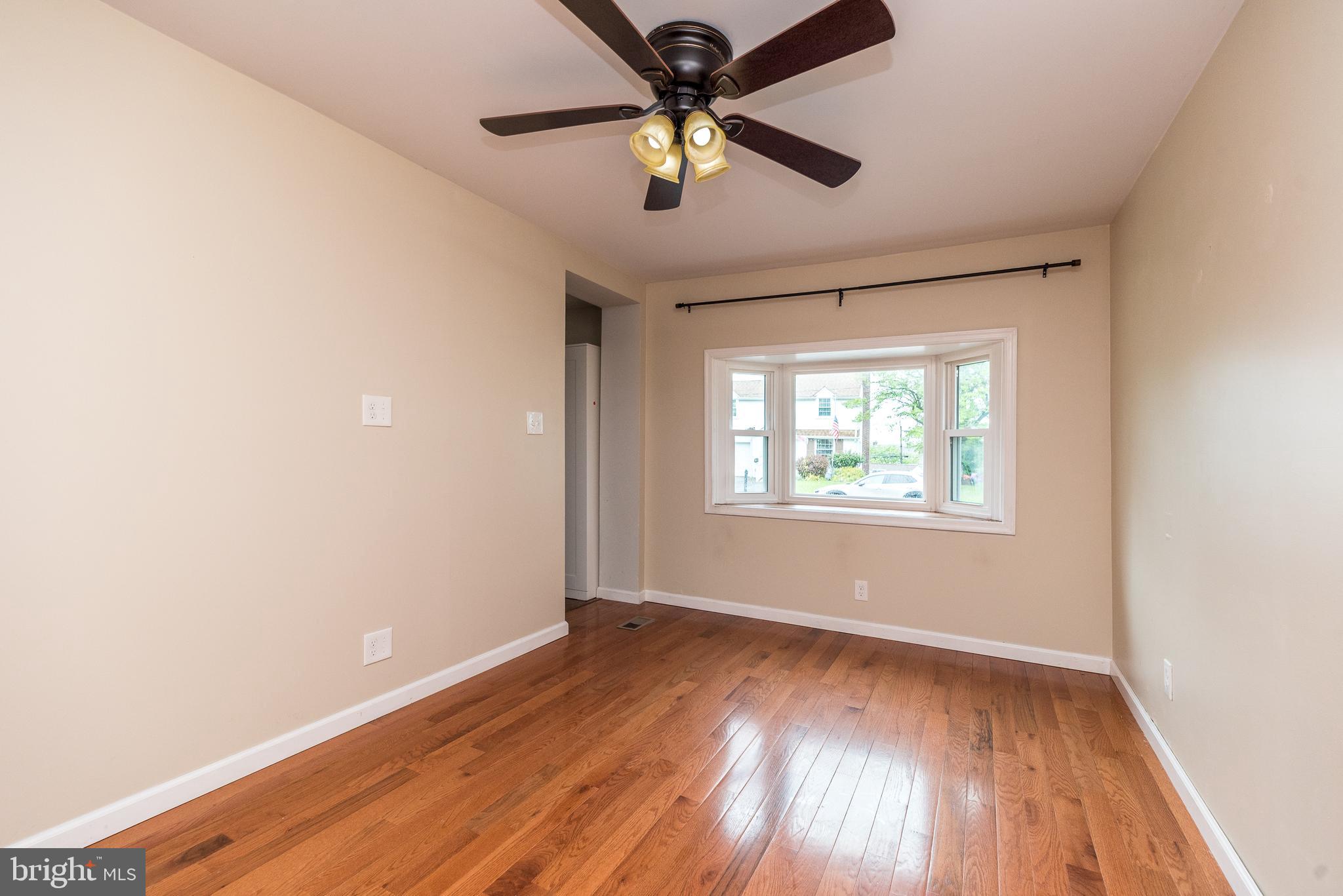 1425 Leedom Road Havertown, PA 19083 - Photo 17 of 46 wooden floor in an empty room with a window