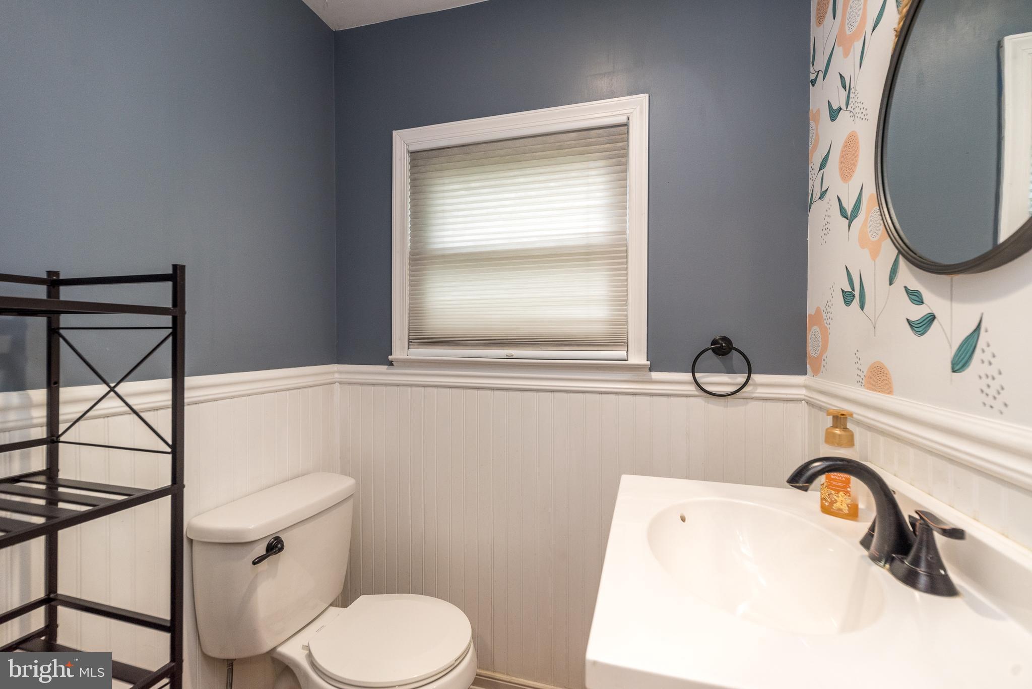 1425 Leedom Road Havertown, PA 19083 - Photo 25 of 46 a bathroom with a sink a toilet and a mirror