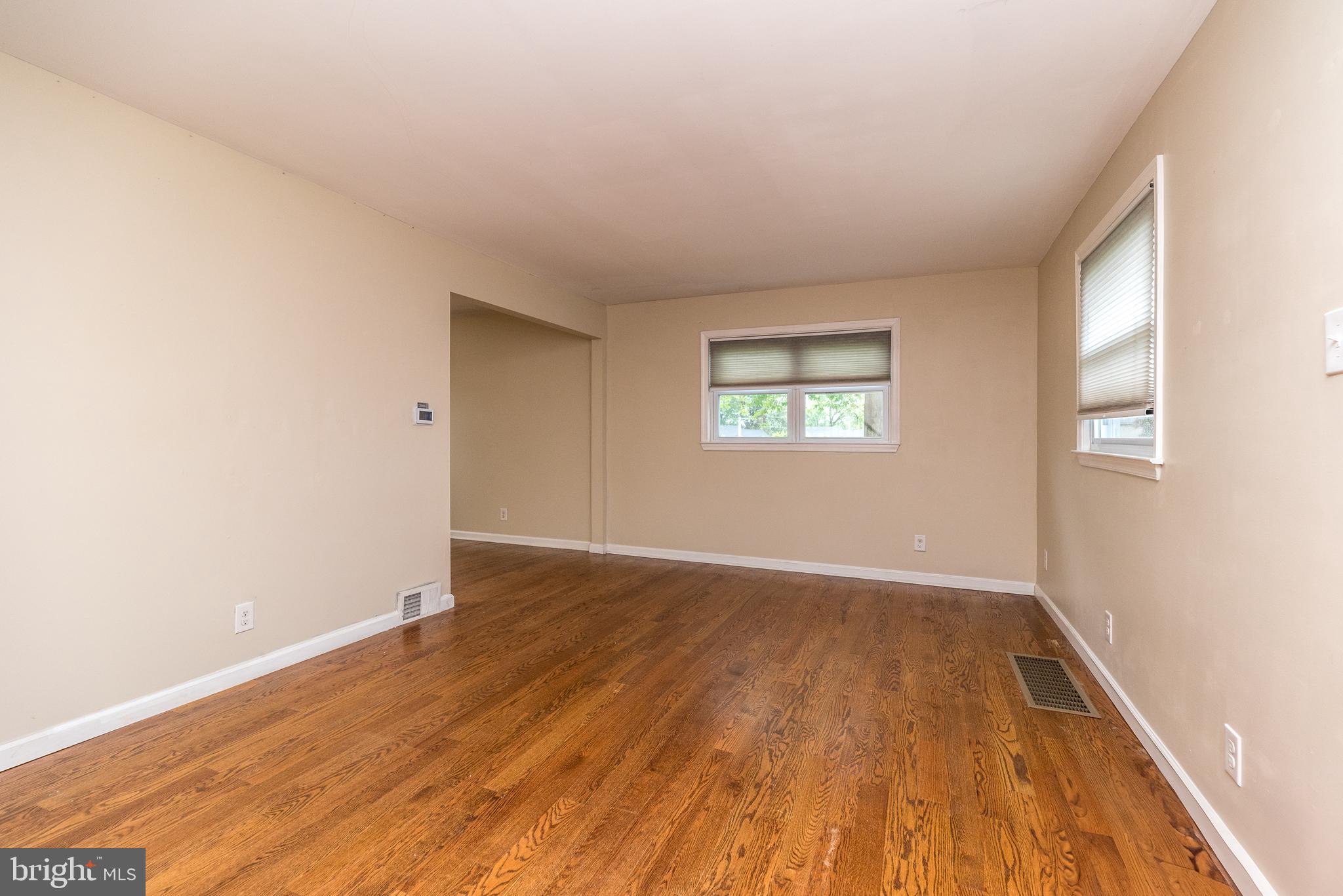 1425 Leedom Road Havertown, PA 19083 - Photo 4 of 46 an empty room with wooden floor and windows