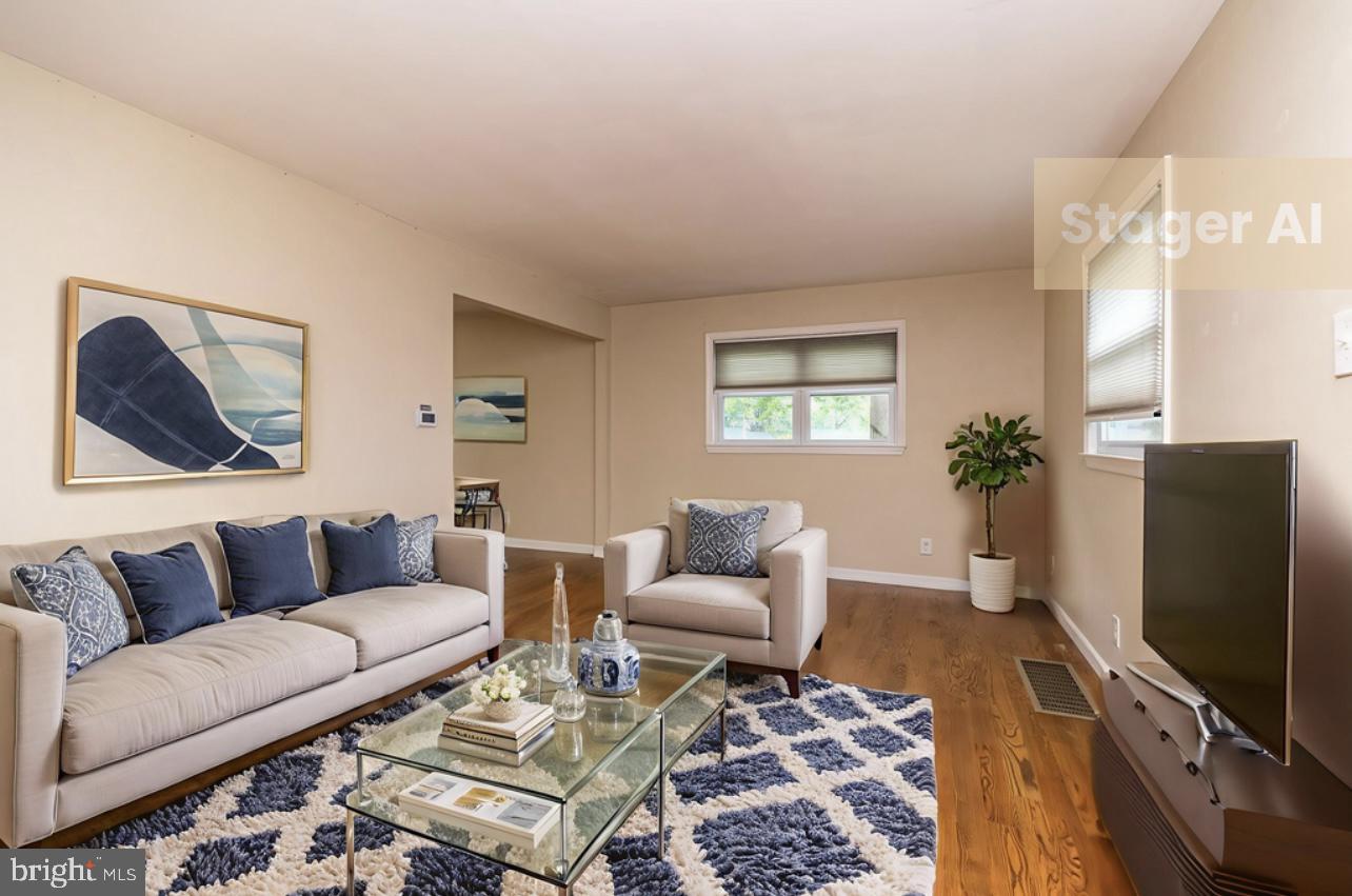 1425 Leedom Road Havertown, PA 19083 - Photo 5 of 46 a living room with furniture a couch and a flat screen tv