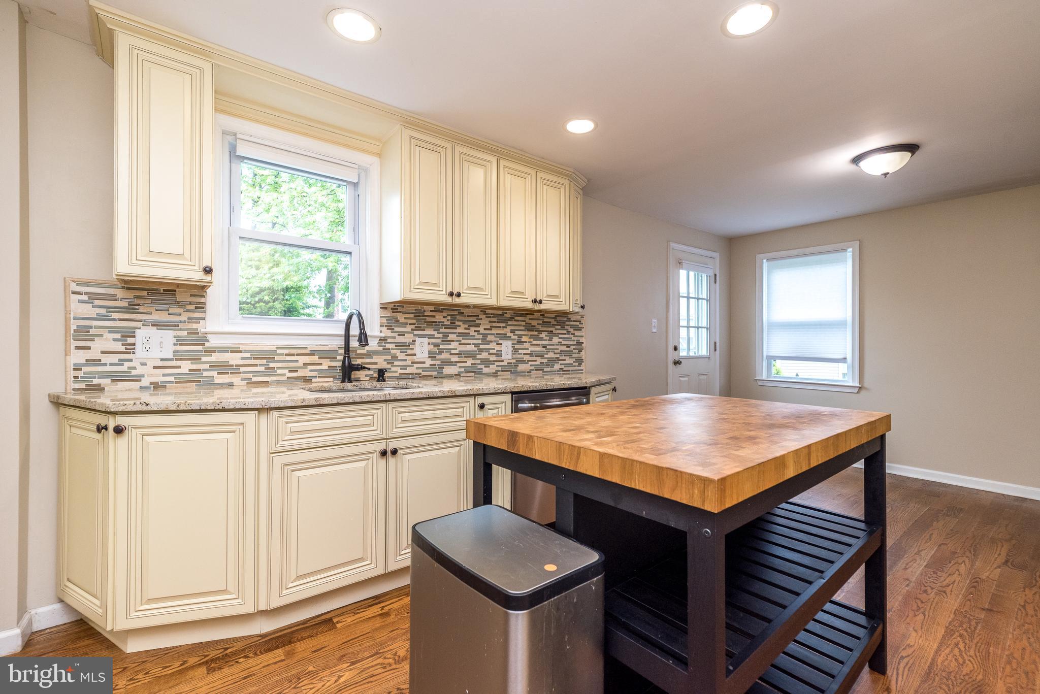 1425 Leedom Road Havertown, PA 19083 - Photo 9 of 46 a kitchen with granite countertop a sink stove and cabinets