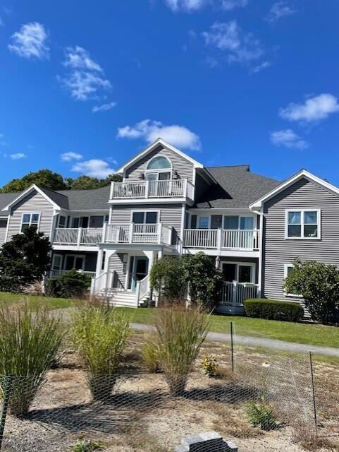720 Pitchers Way, Unit 40F Hyannis, MA 02601 - Photo 1 of 2 a front view of a house with a yard