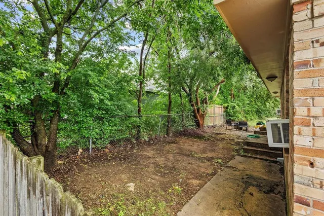a view of backyard with green space