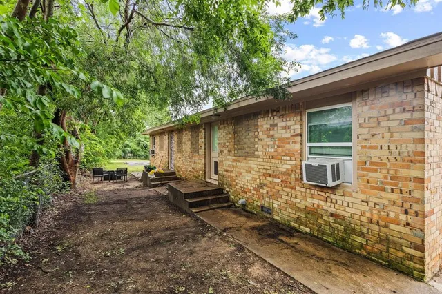 a backyard of a house with seating space
