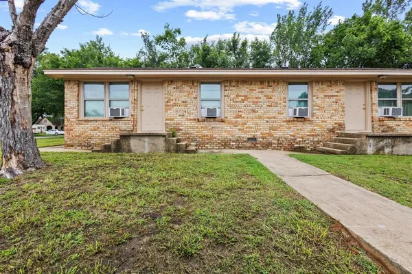 front view of a house with a yard