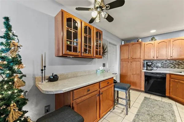 a kitchen with stainless steel appliances a sink stove and cabinets