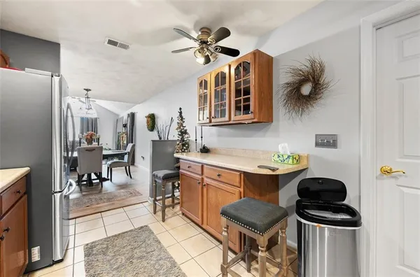 a kitchen with granite countertop a sink stainless steel appliances and cabinets