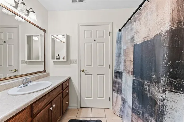 a bedroom with furniture and a chandelier
