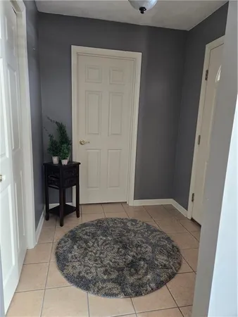 a view of a door and chair in a room