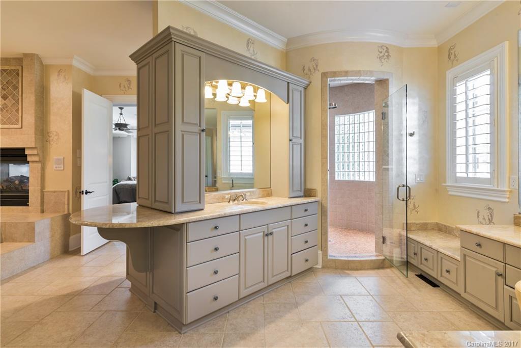 204 Eagle Bend Drive Waxhaw, NC 28173 - Photo 11 of 24 a spacious bathroom with a tub sink shower and mirror