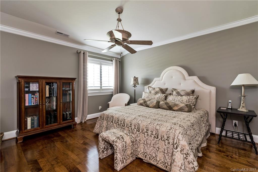 204 Eagle Bend Drive Waxhaw, NC 28173 - Photo 14 of 24 a bedroom with a bed and wooden floor