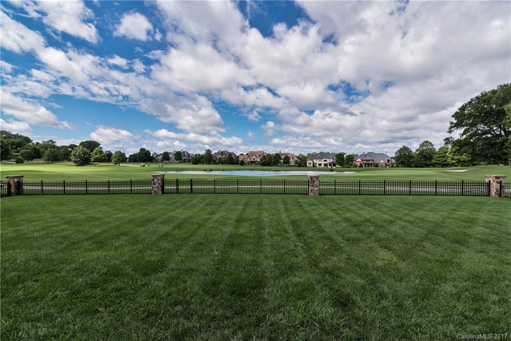 204 Eagle Bend Drive Waxhaw, NC 28173 - Photo 23 of 24 a view of a golf course with a lake