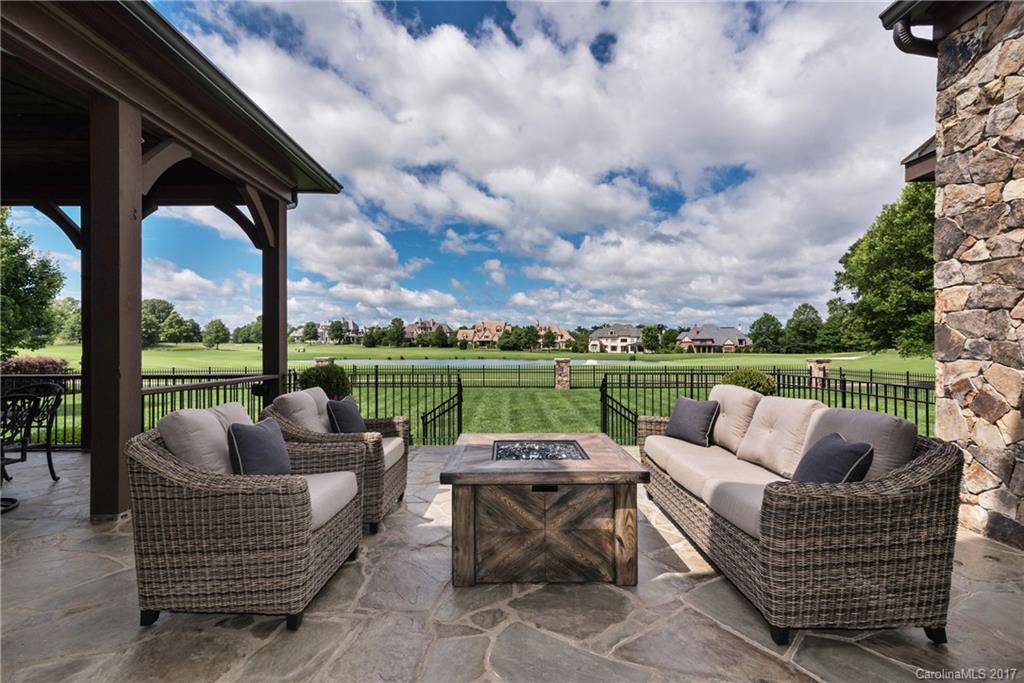 204 Eagle Bend Drive Waxhaw, NC 28173 - Photo 5 of 24 an outdoor sitting area with furniture and garden