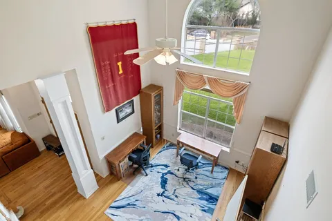a view of a living room with furniture and a window