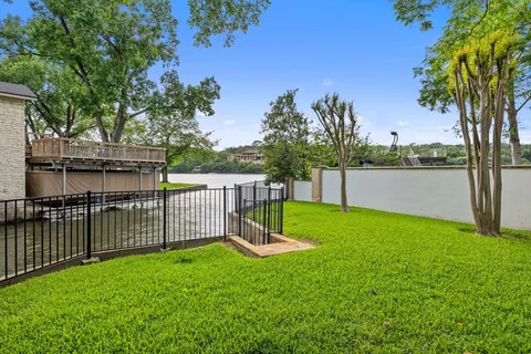 a balcony with trees in front of it