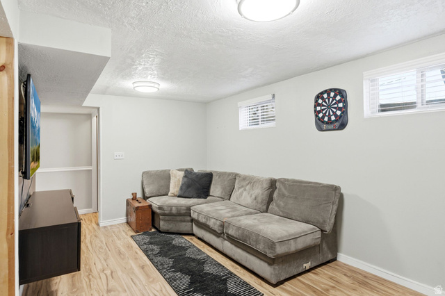 935 900 North Bountiful, UT 84010 - Photo 29 of 46 Living room featuring light wood-style flooring and a textured ceiling