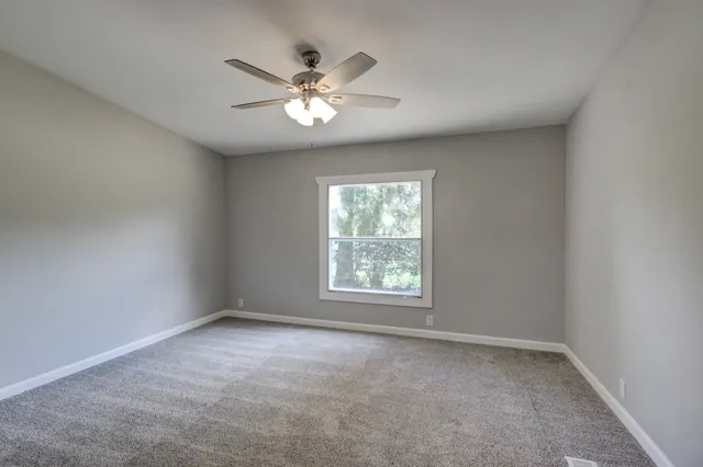 a bathroom with a sink and mirror with toilet