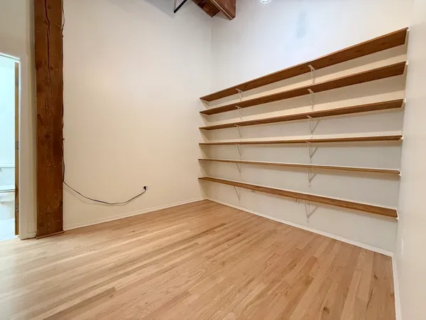 a view of a room with storage and utility room