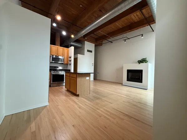 a view of kitchen and wooden floor