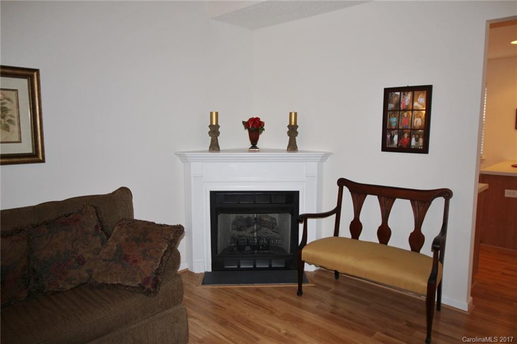 8254 Rudolph Road Charlotte, NC 28216 - Photo 14 of 24 a living room with furniture and a fireplace