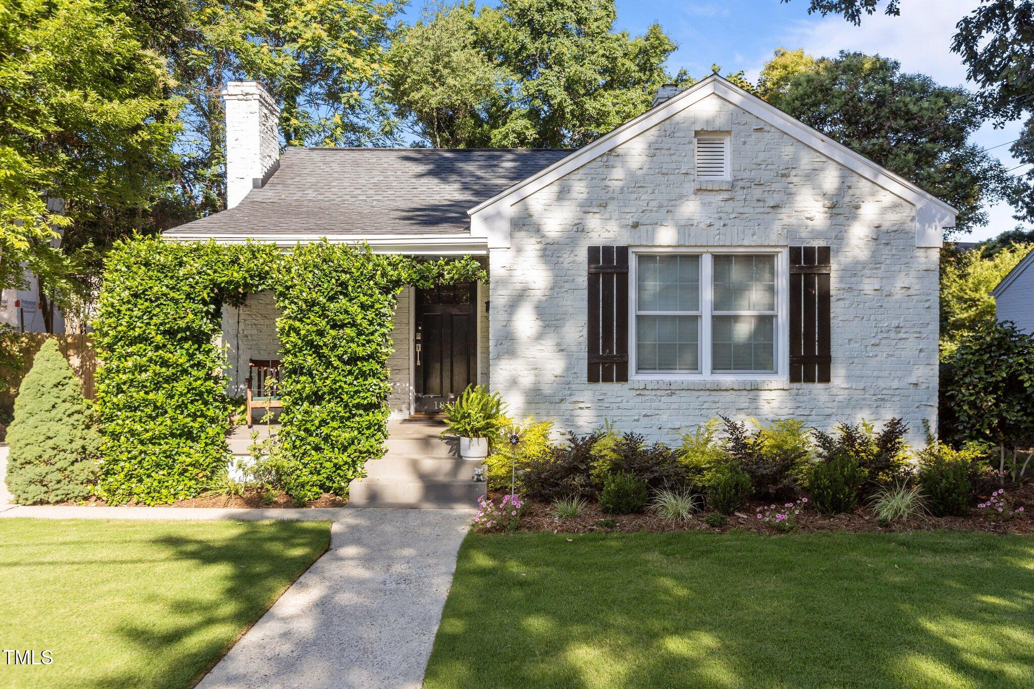 1811 Ridley Street Raleigh, NC 27608 - Photo 1 of 48 a front view of a house with a yard