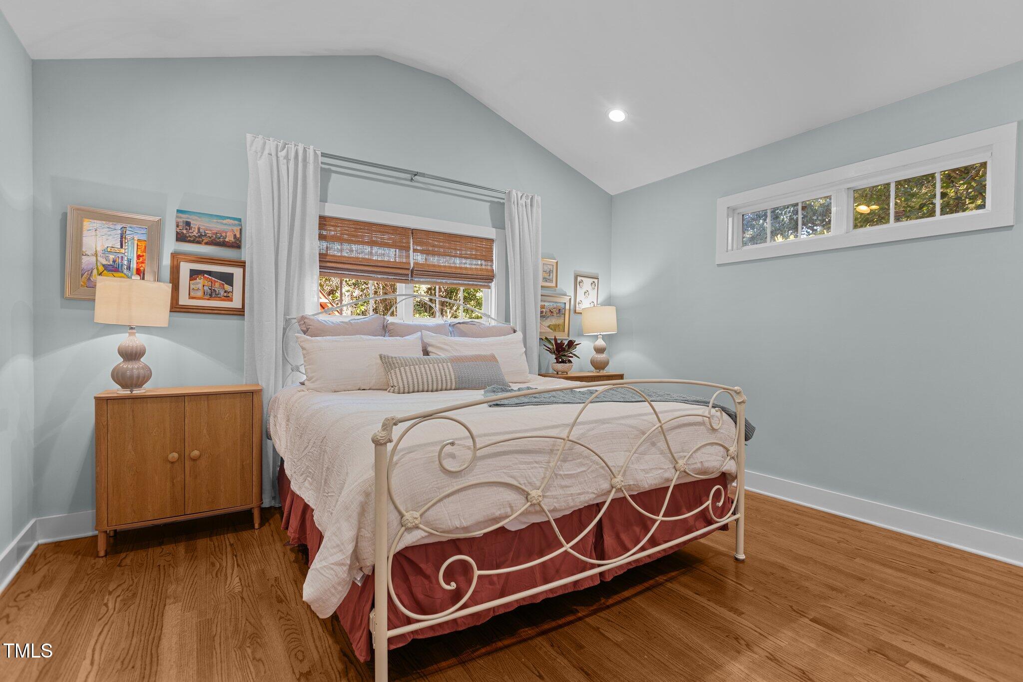 1811 Ridley Street Raleigh, NC 27608 - Photo 13 of 48 a bedroom with a bed and a dresser