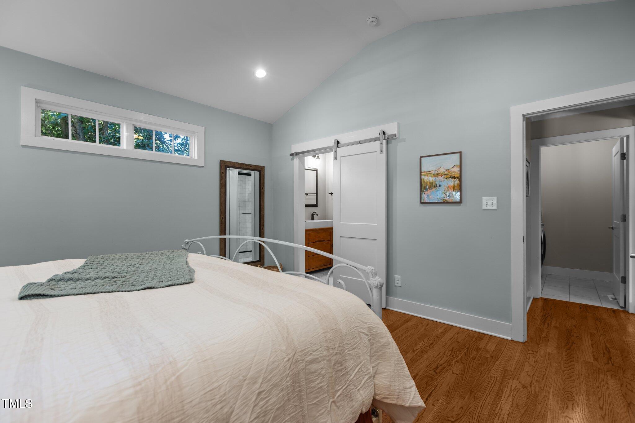 1811 Ridley Street Raleigh, NC 27608 - Photo 14 of 48 a bedroom with a bed and a dresser