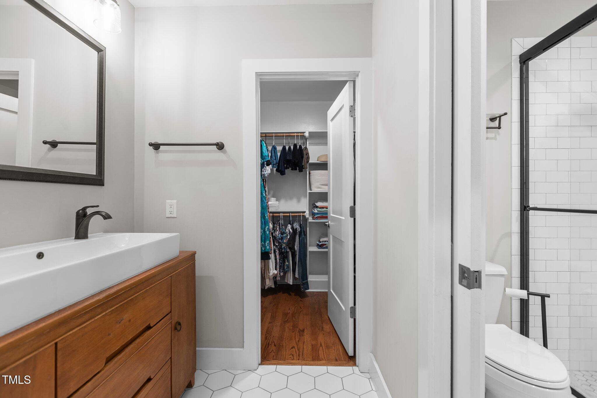 1811 Ridley Street Raleigh, NC 27608 - Photo 16 of 48 a bathroom with a sink and mirror