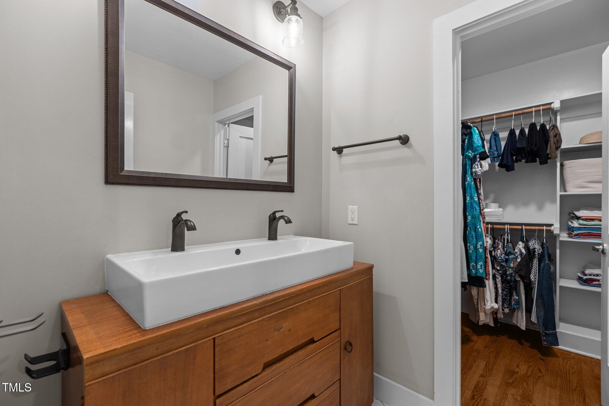 1811 Ridley Street Raleigh, NC 27608 - Photo 17 of 48 a bathroom with a sink and a mirror