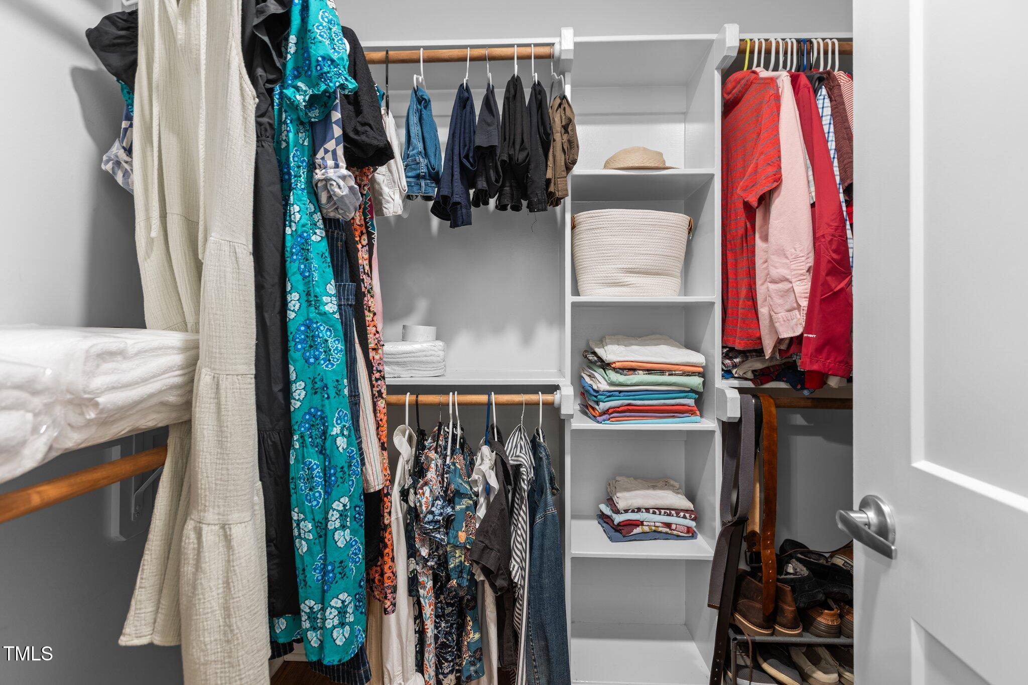 1811 Ridley Street Raleigh, NC 27608 - Photo 19 of 48 a view of walk in closet with clothes