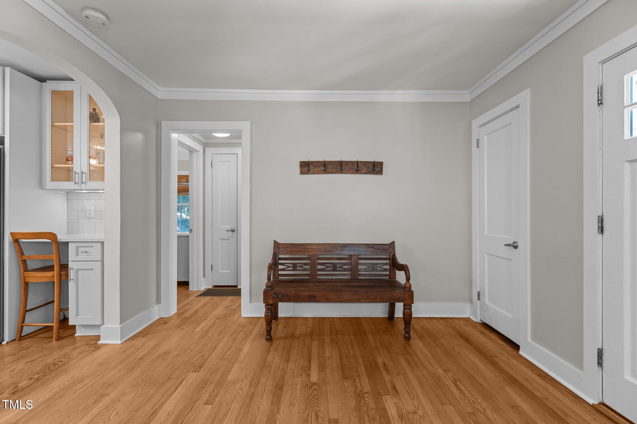 1811 Ridley Street Raleigh, NC 27608 - Photo 28 of 48 a view of an empty room with wooden floor and a window