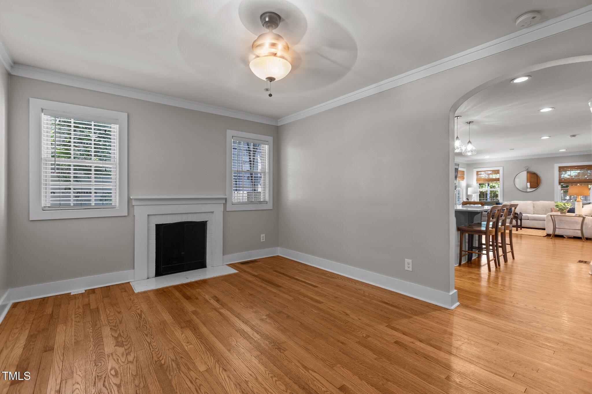 1811 Ridley Street Raleigh, NC 27608 - Photo 29 of 48 wooden floor in an empty room with a window