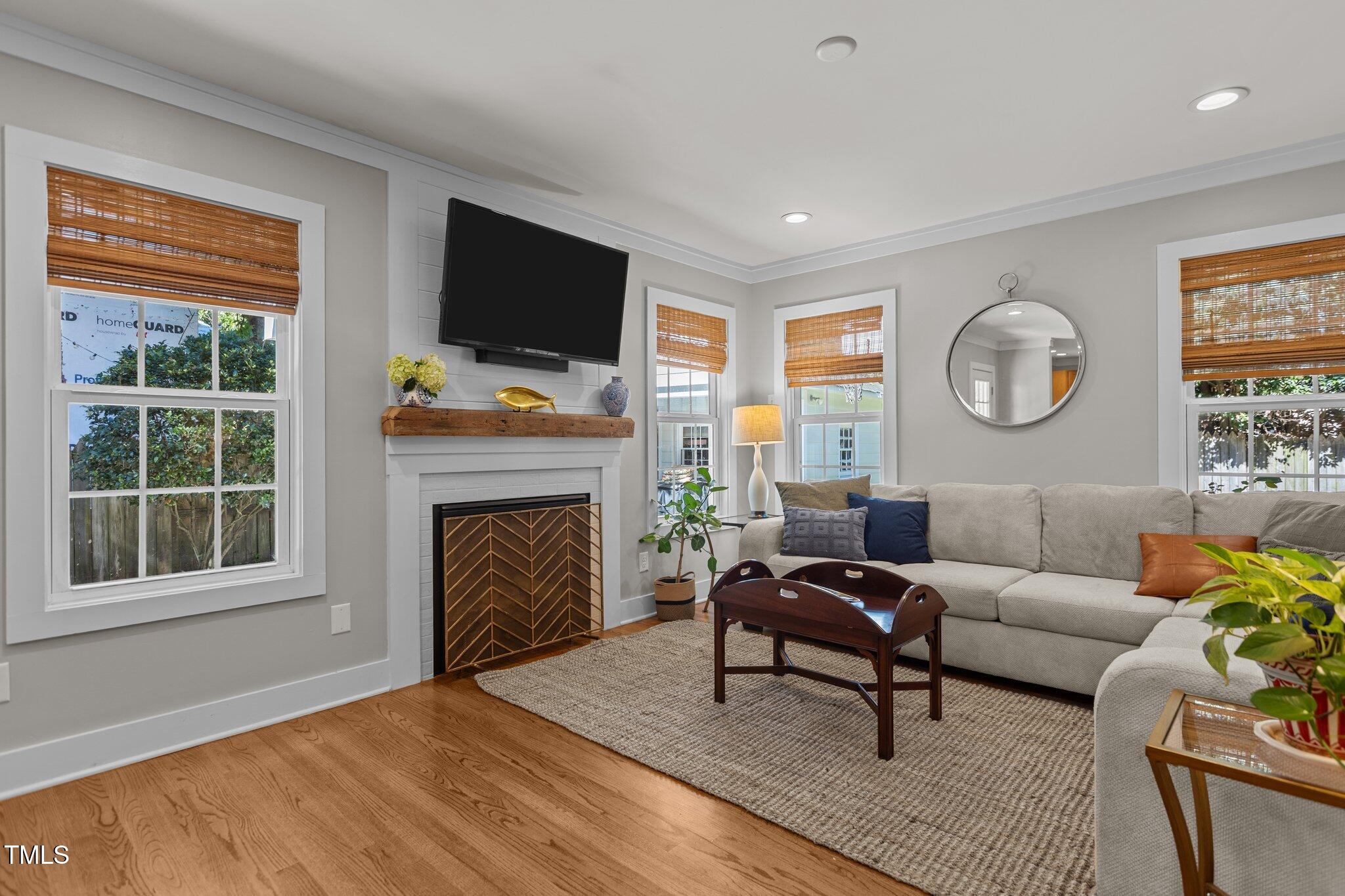 1811 Ridley Street Raleigh, NC 27608 - Photo 3 of 48 a living room with furniture and a fireplace
