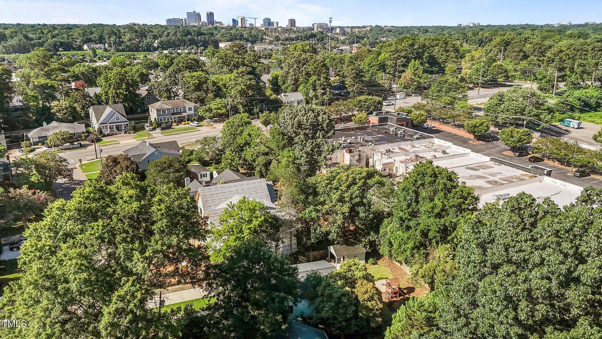1811 Ridley Street Raleigh, NC 27608 - Photo 35 of 48 an aerial view of residential house with outdoor space and trees all around
