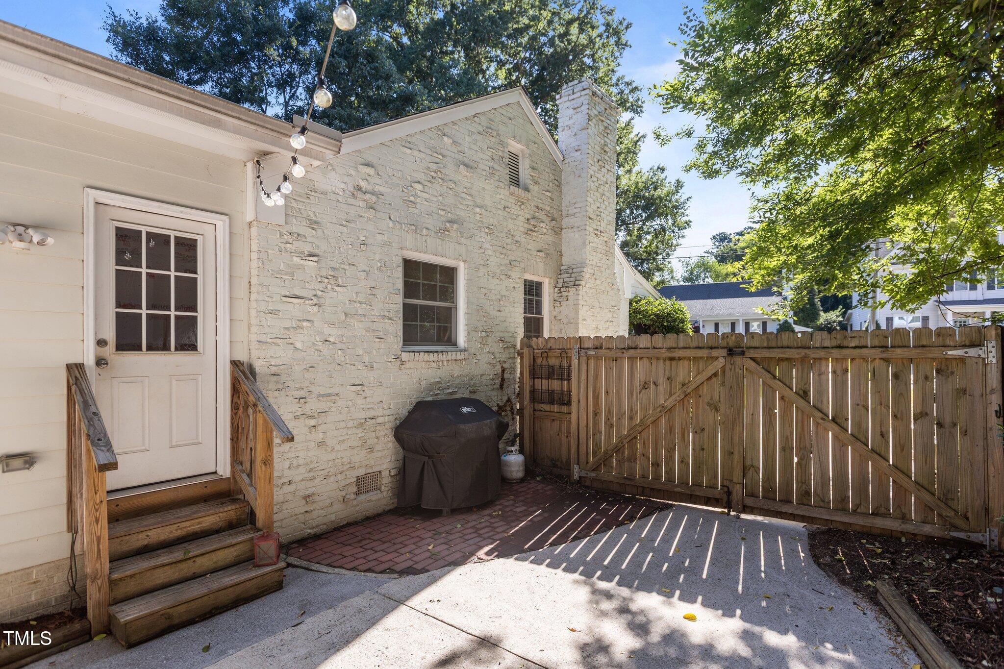 1811 Ridley Street Raleigh, NC 27608 - Photo 48 of 48 a view of a wooden door and a yard