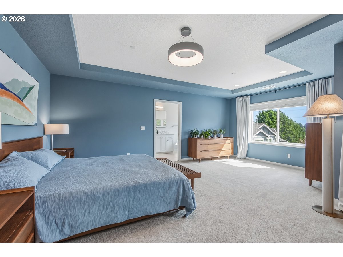 16275 Southwest Jade View Way Beaverton, OR 97007 - Photo 14 of 34 a bedroom with a bed and a large window