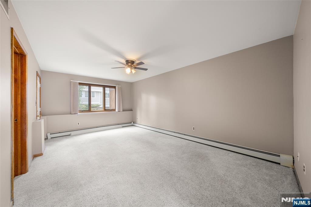 140 Allwood Road, Unit C Clifton, NJ 07012 - Photo 5 of 31 a view of an empty room with a window