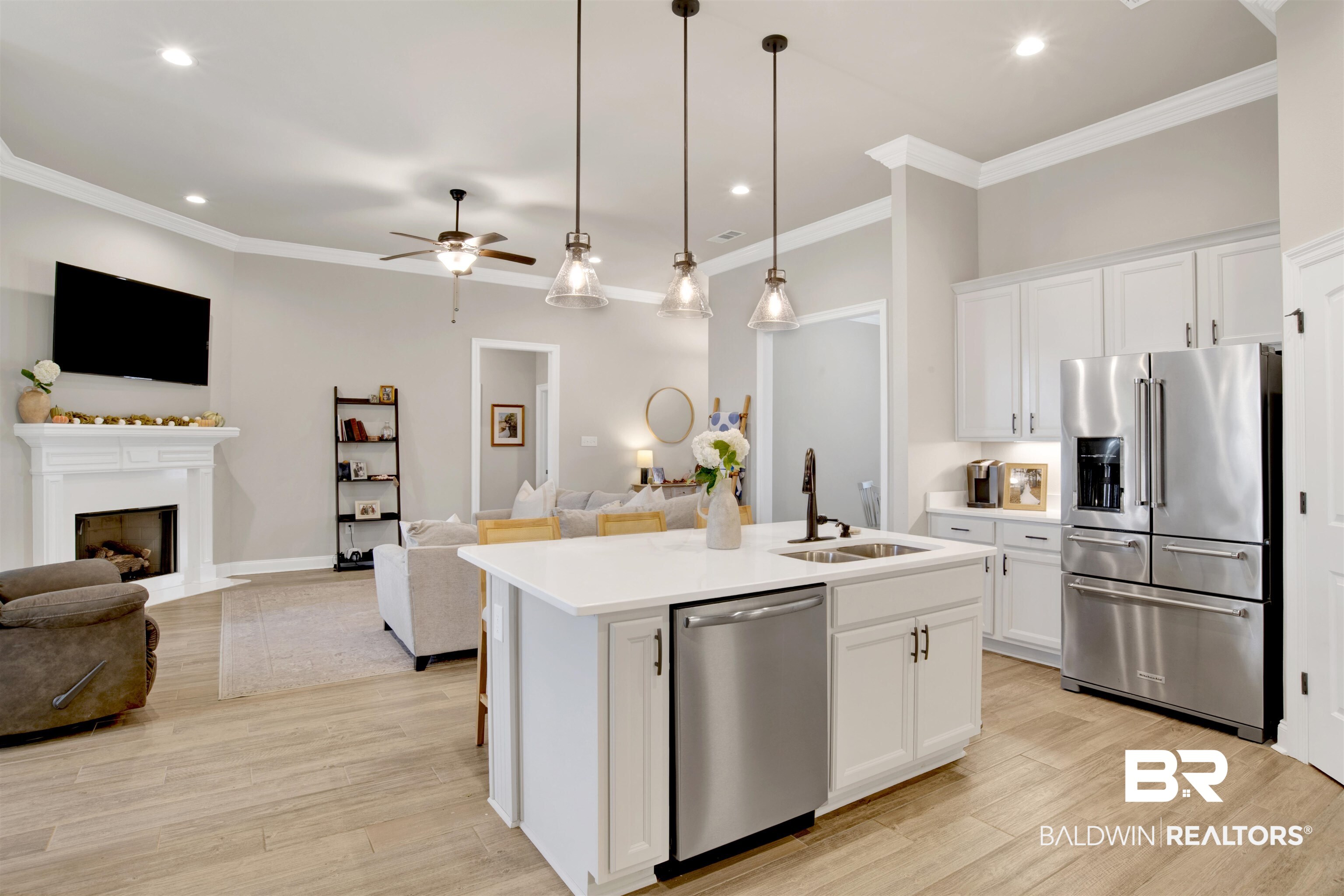 30770 Marcel Boulevard Spanish Fort, AL 36527 - Photo 9 of 23 Kitchen with a center island with sink, stainless steel appliances, sink, and white cabinets