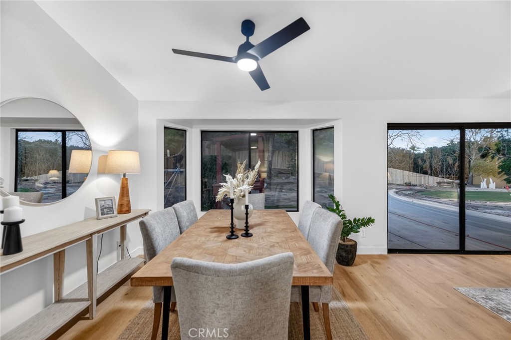 32042 Merlot Court Temecula, CA 92591 - Photo 20 of 46 a dining room with furniture and a floor to ceiling window