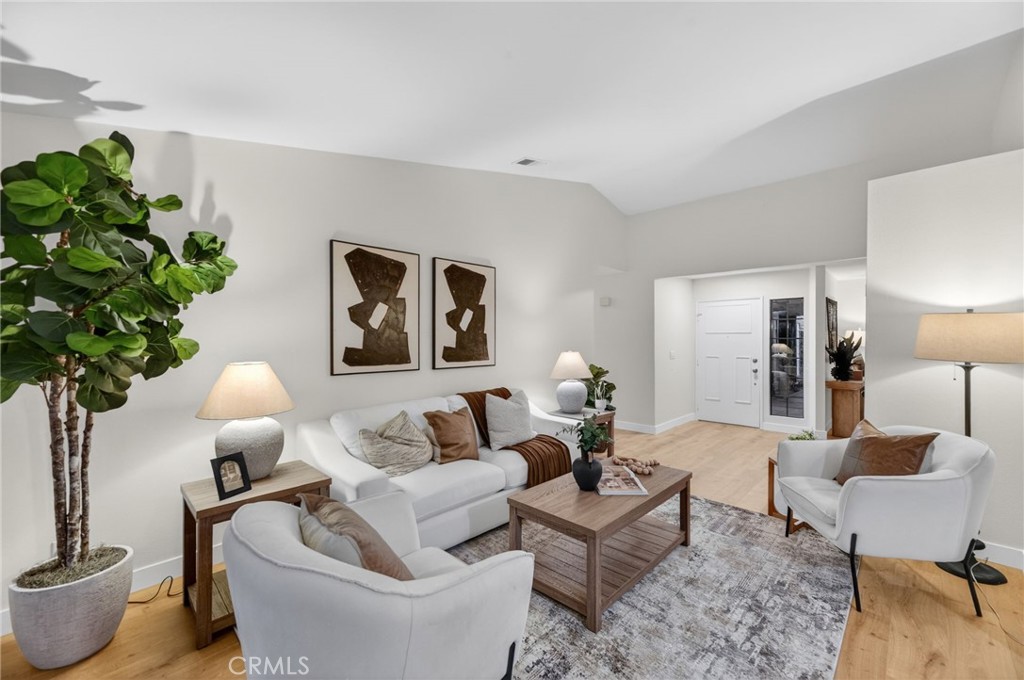 32042 Merlot Court Temecula, CA 92591 - Photo 24 of 46 a living room with furniture and a lamp
