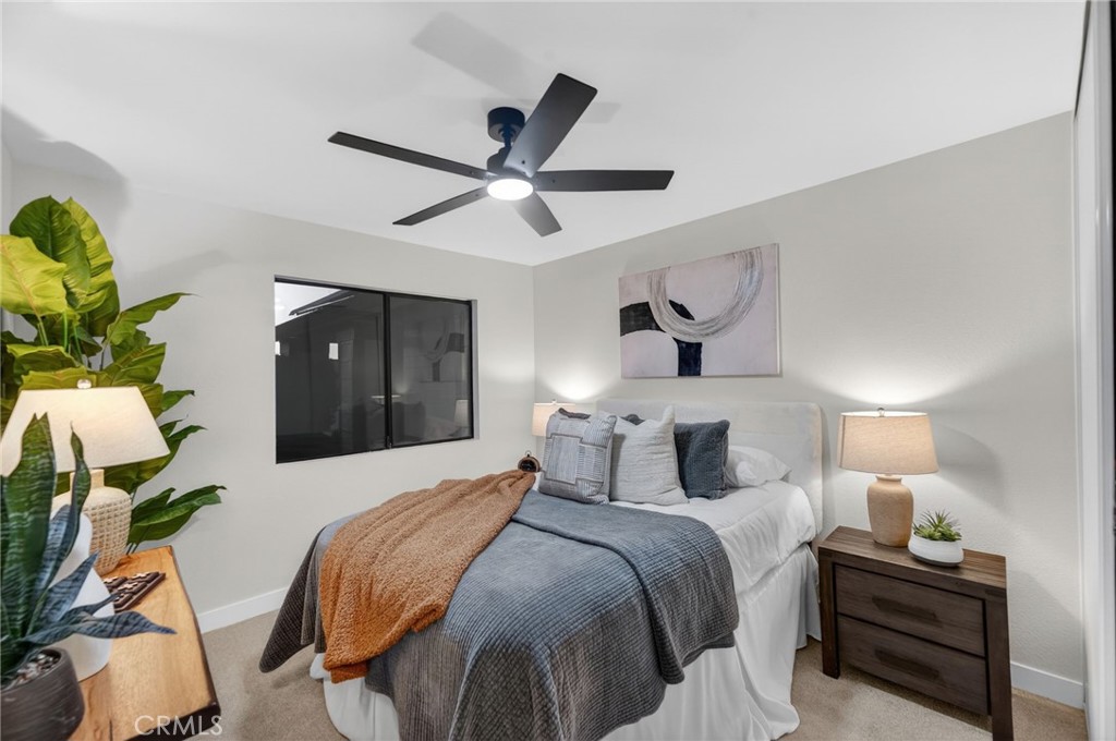 32042 Merlot Court Temecula, CA 92591 - Photo 28 of 46 a bedroom with a bed and a chandelier