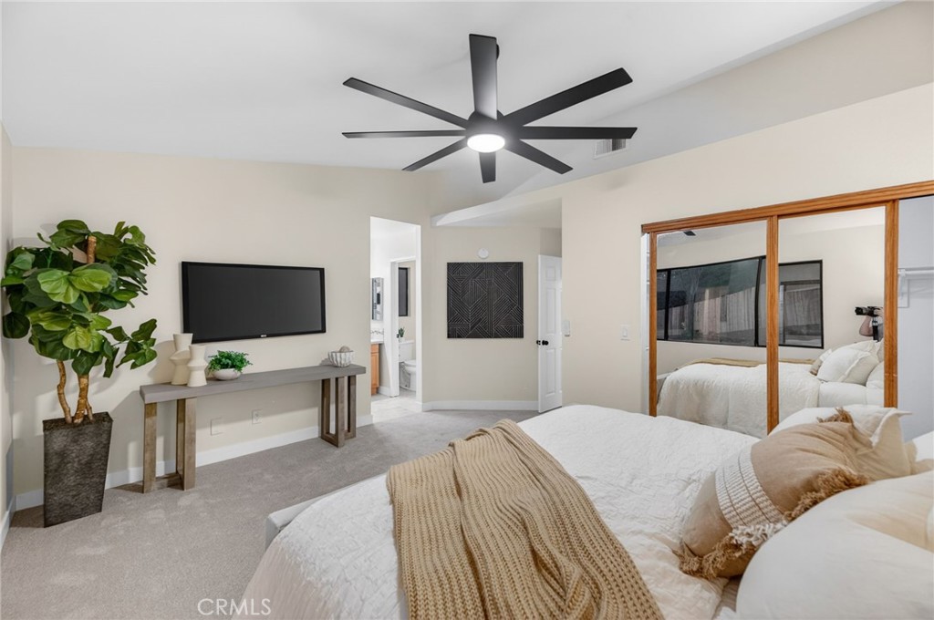 32042 Merlot Court Temecula, CA 92591 - Photo 34 of 46 a bedroom with a bed and a flat screen tv