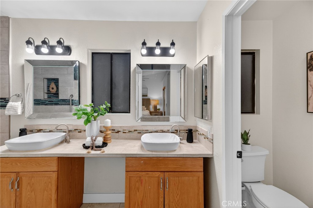 32042 Merlot Court Temecula, CA 92591 - Photo 35 of 46 a bathroom with a sink double vanity and a mirror