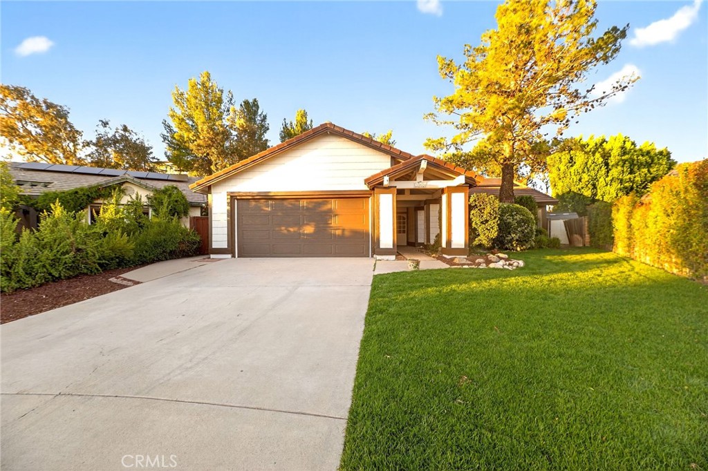 32042 Merlot Court Temecula, CA 92591 - Photo 4 of 46 a front view of a house with a yard and trees