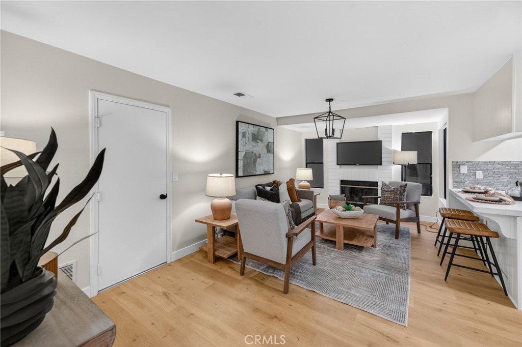 32042 Merlot Court Temecula, CA 92591 - Photo 9 of 46 a living room with furniture a rug and a flat screen tv