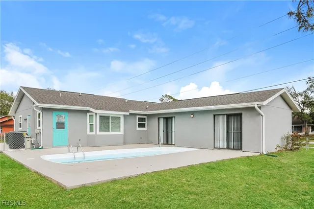a view of a house with a yard and garage